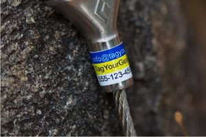 Close up picture of a 3 stripe wide rectangular label on a climbing cam's stem.